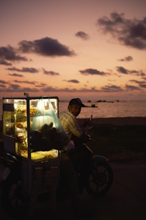 A scenic view of street food vendors at sunset.