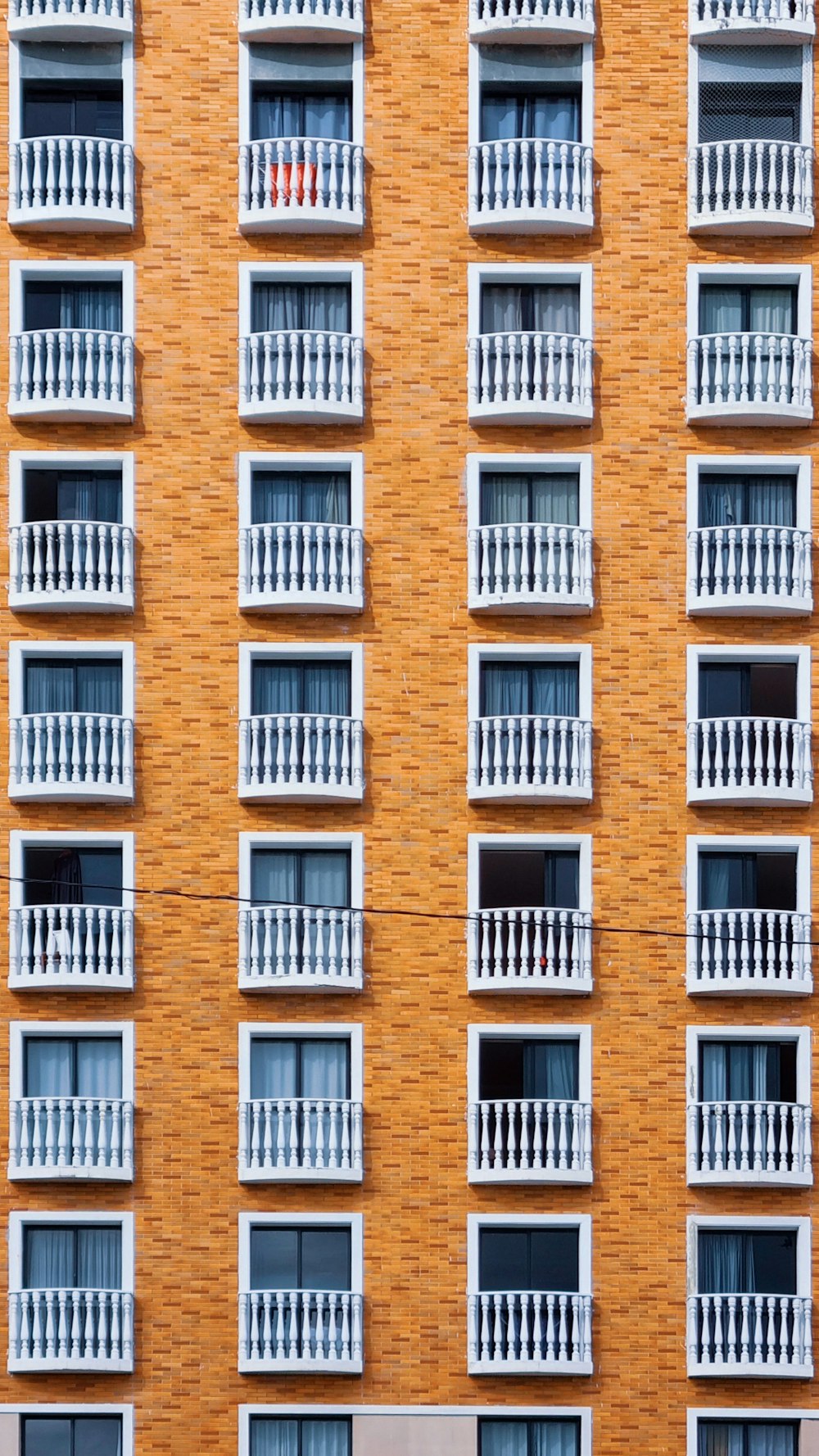 a tall brick building with balconies and balconies