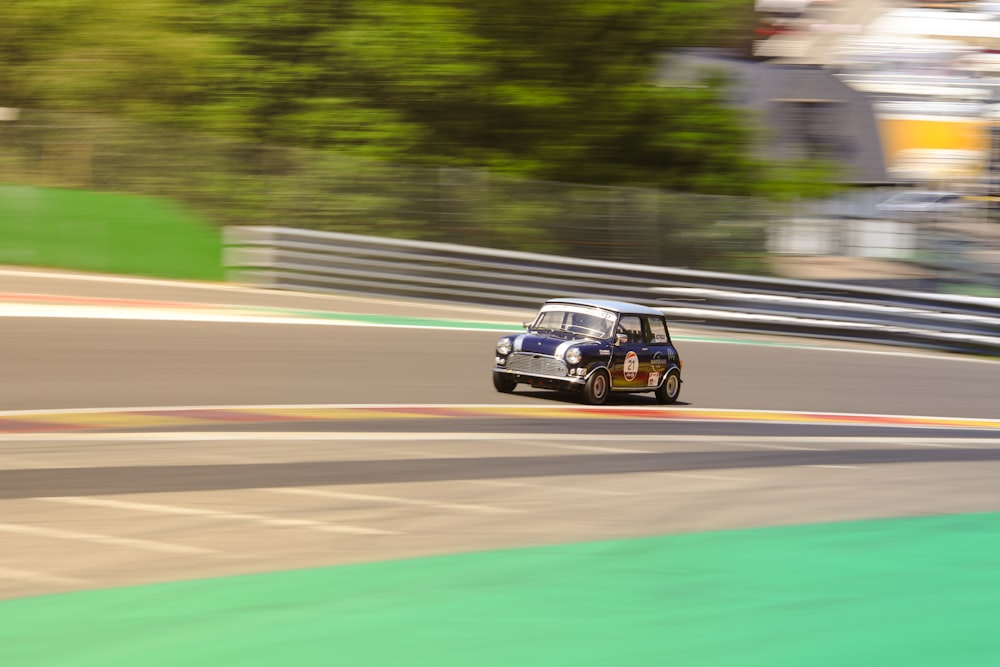 a mini car driving down a race track