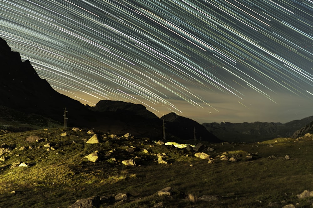 the night sky is filled with star trails