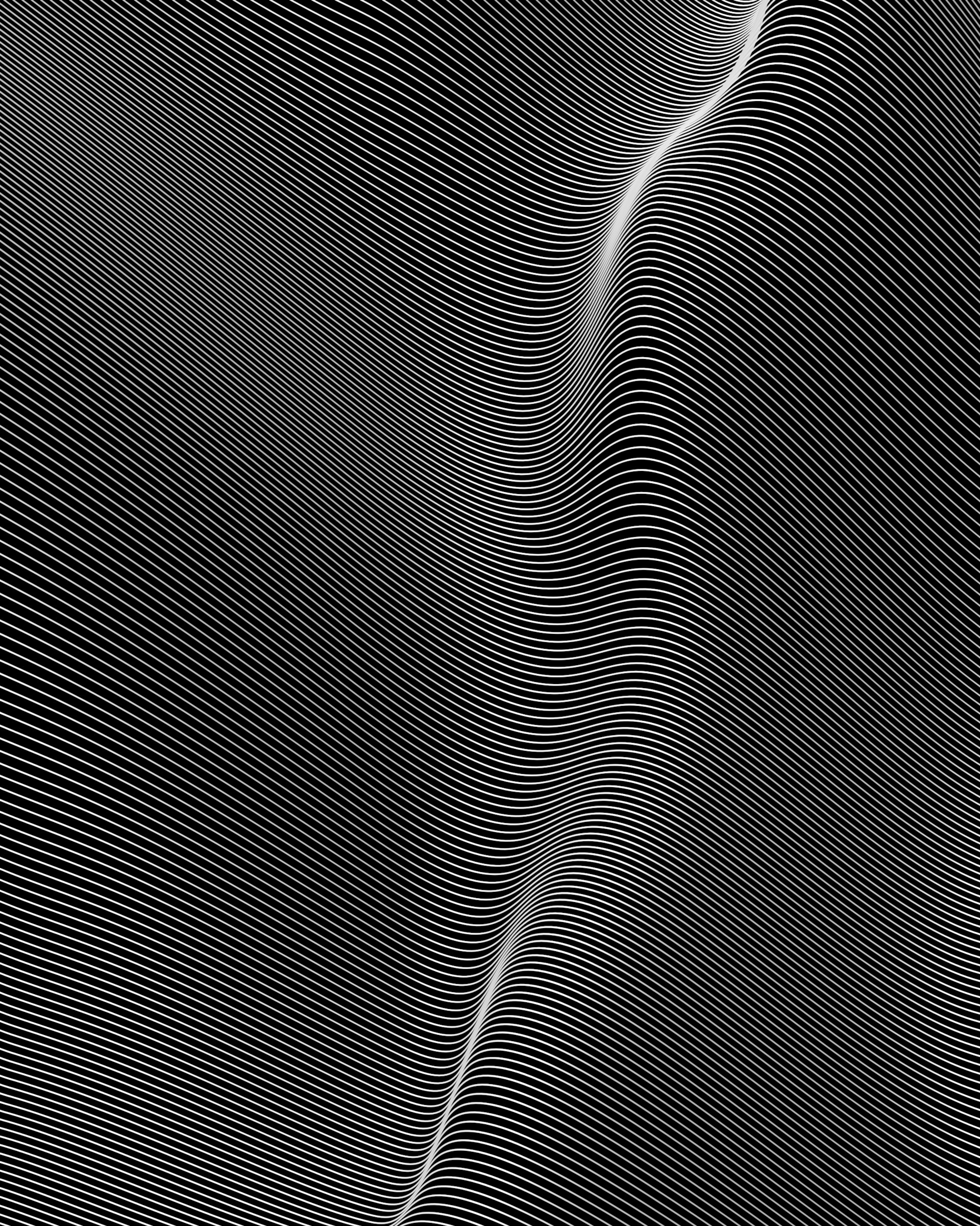 a black and white photo of a wave
