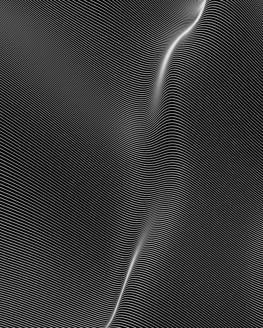 Una foto in bianco e nero di un'onda