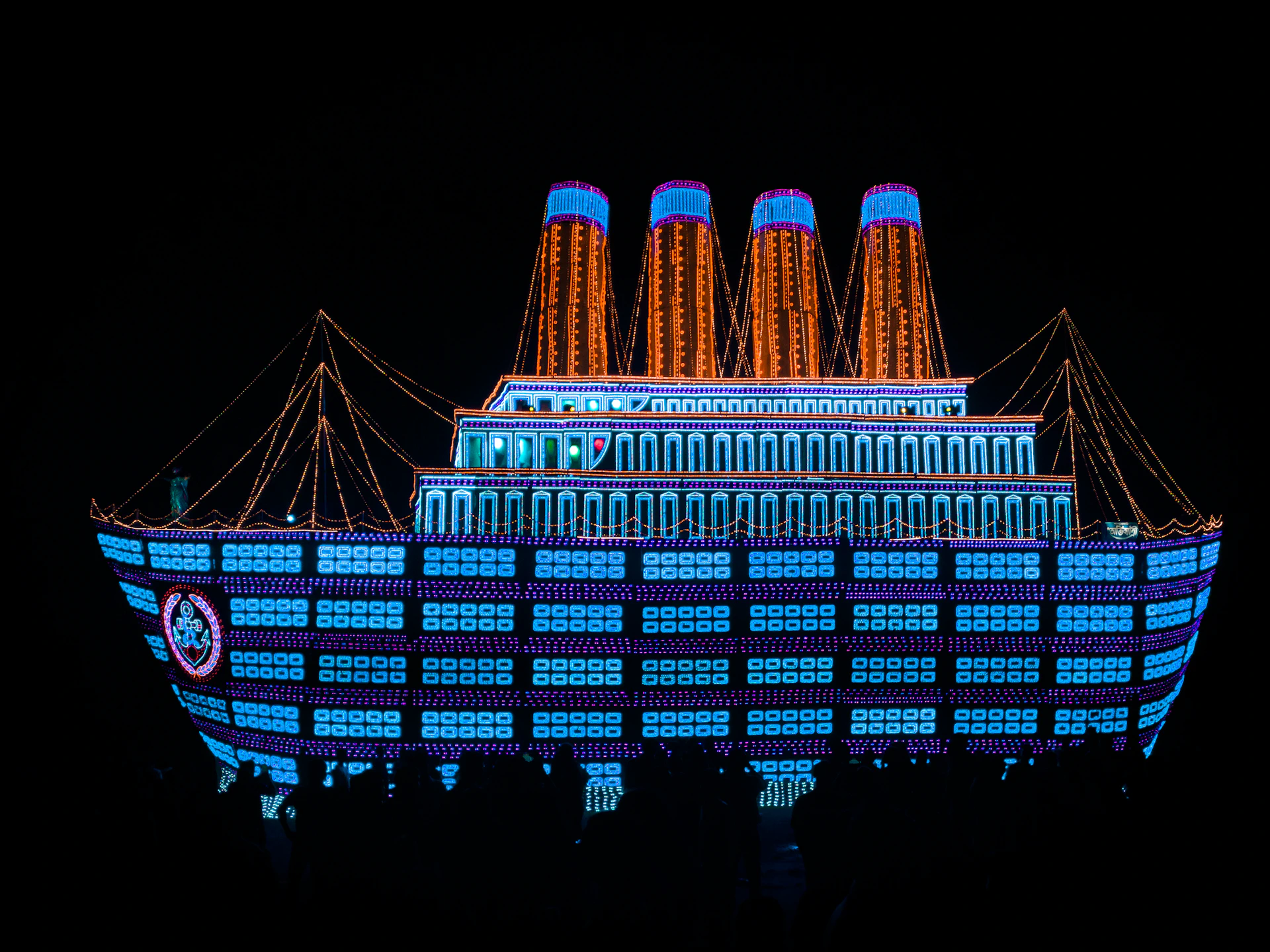 a large building lit up with christmas lights