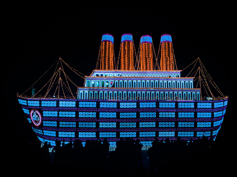 a large building lit up with christmas lights