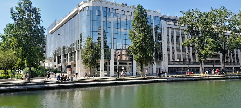 a large building sitting next to a body of water