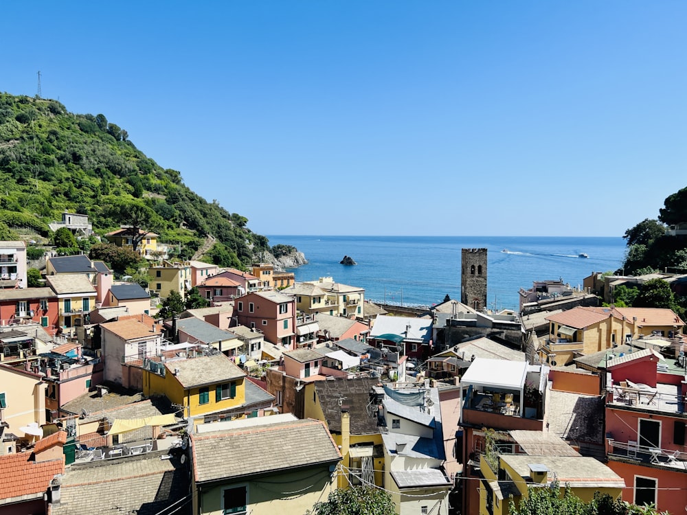 a view of a town with a body of water in the background