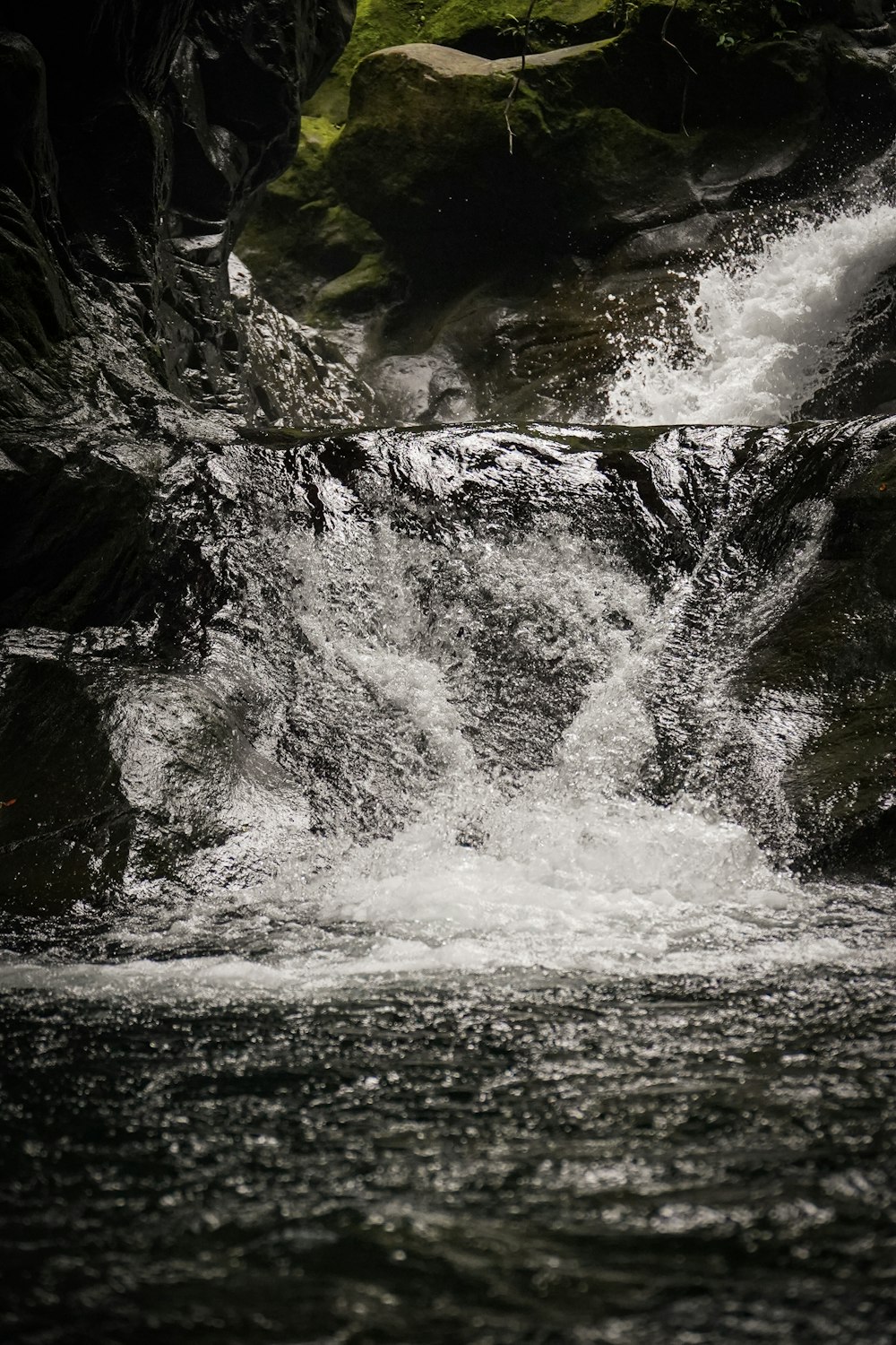 a man riding a surfboard on top of a river