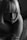 A monochrome photograph captures a person with short, straight hair. The lighting creates dramatic shadows across the face, emphasizing the contours and facial features. The overall mood is introspective and calm.