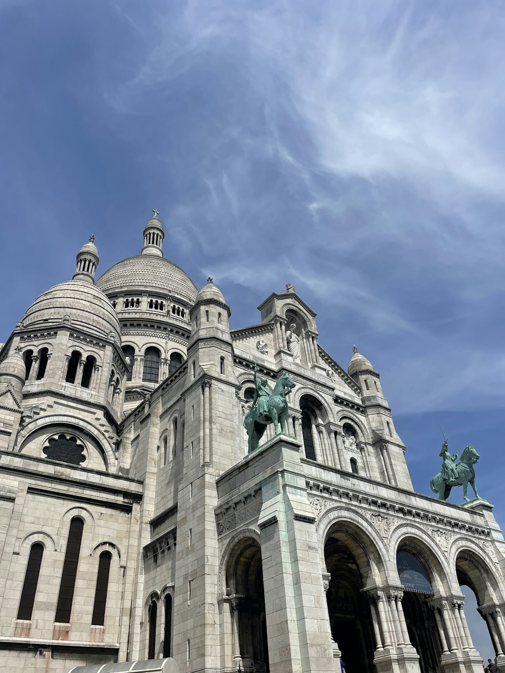 a large building with a statue on top of it