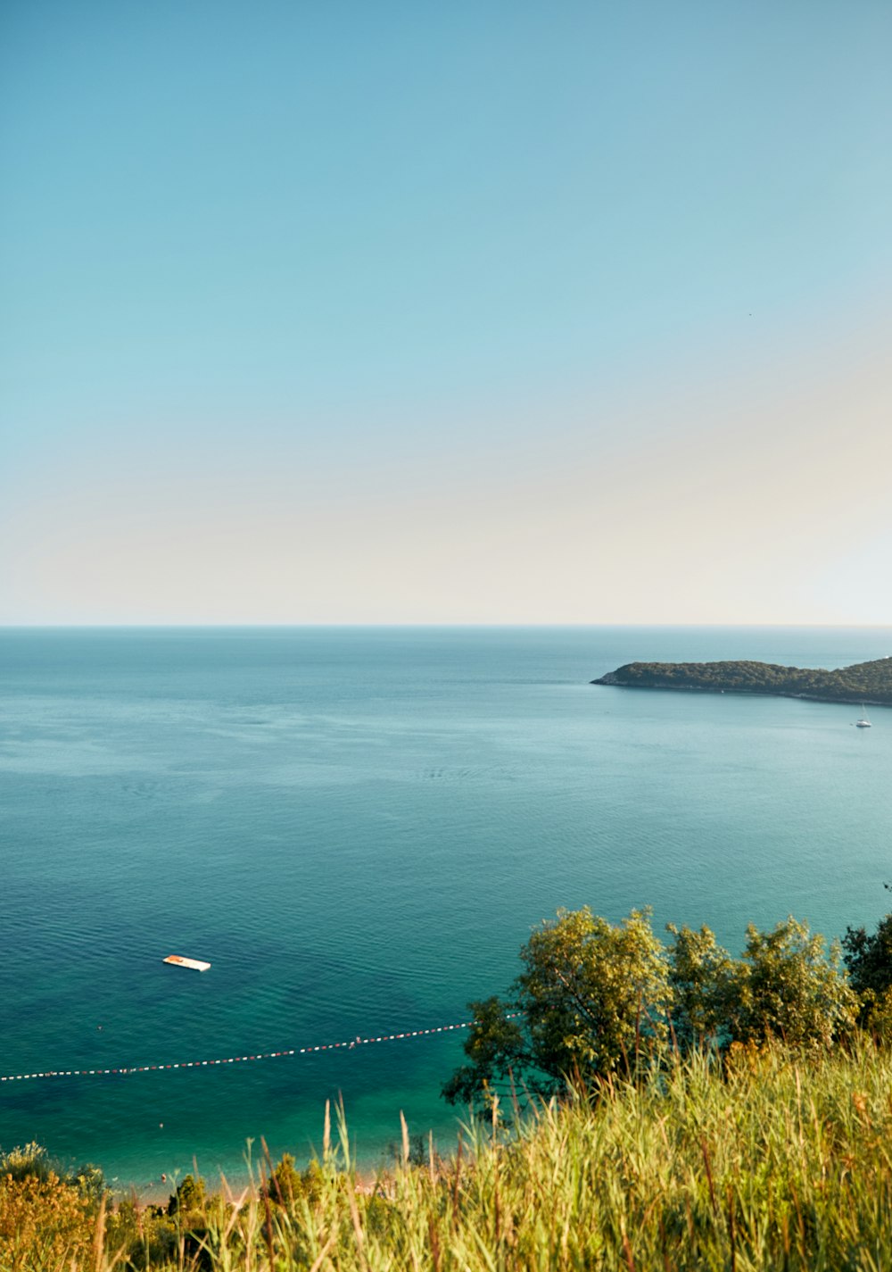 a body of water with a boat in the distance