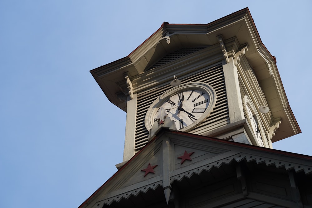 a large clock tower with a sky background