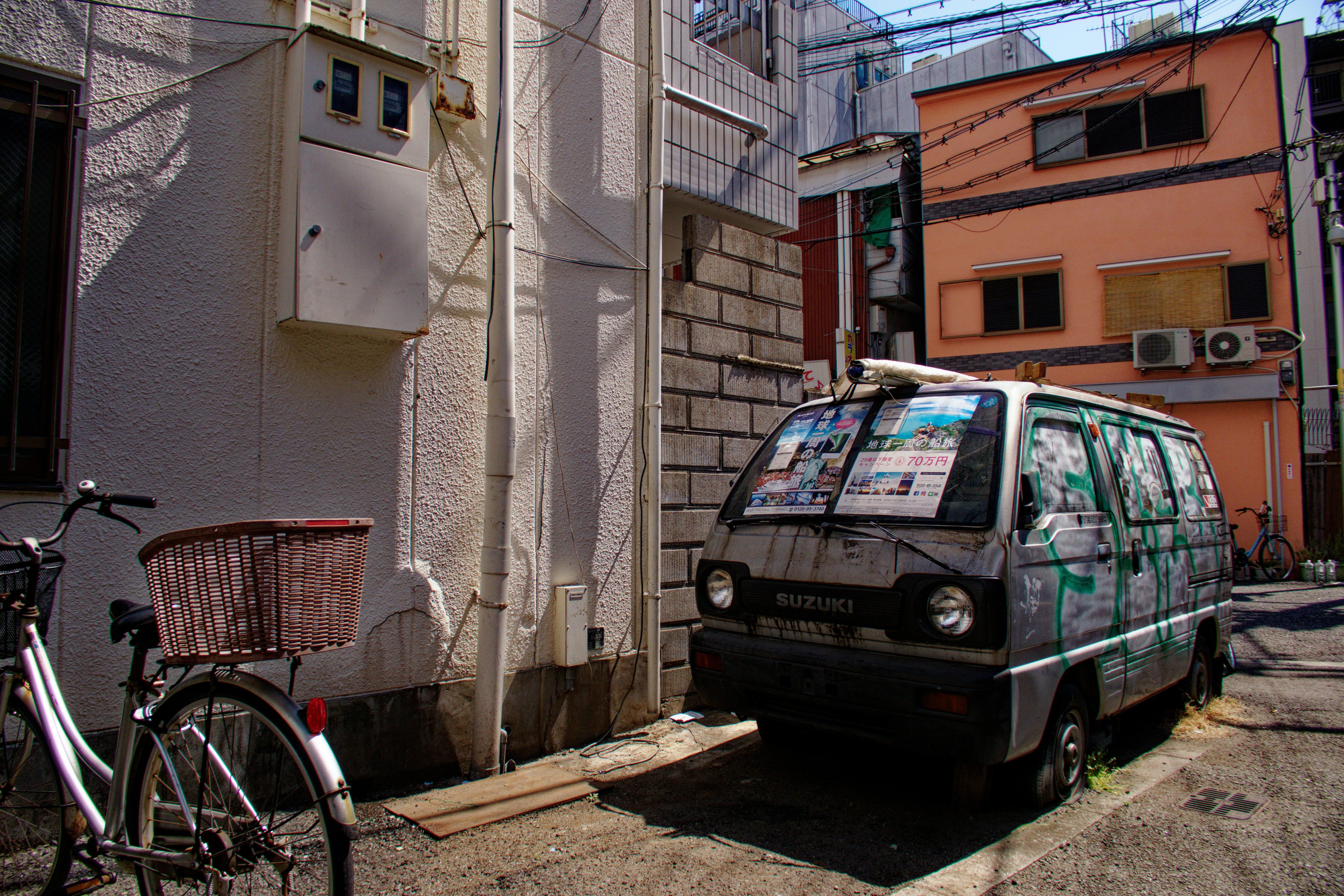Hybrid car wheel and tyre on a wet city street