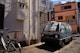 a van parked on the side of a street next to a bike