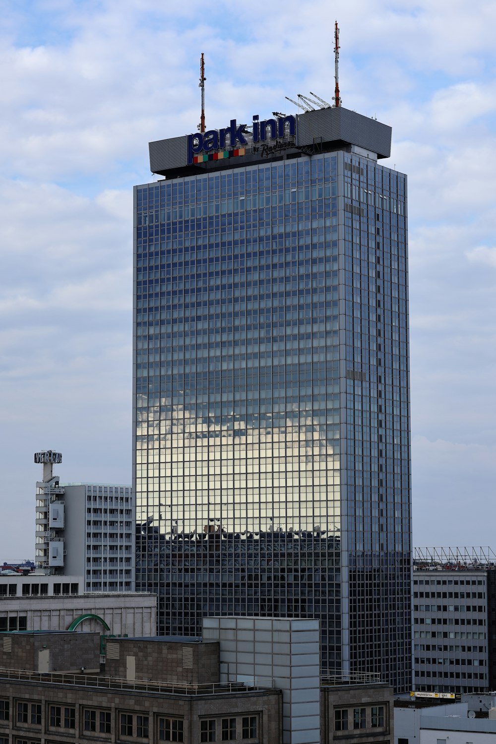 a very tall building with a sky background