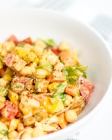 Freshly prepared African salad with leafy greens and bright ingredients.