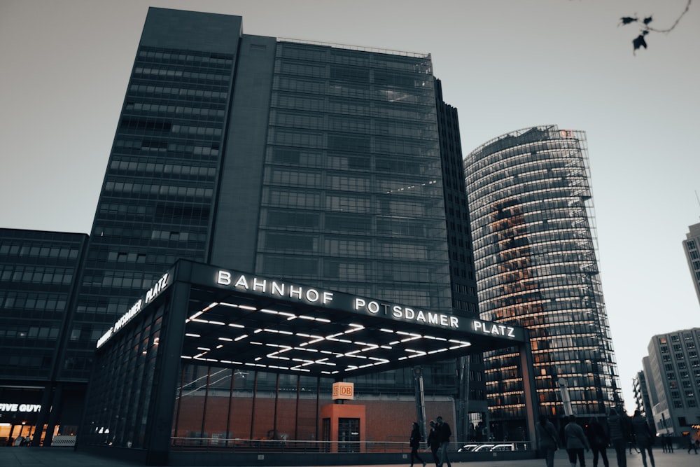 a group of people standing outside of a building