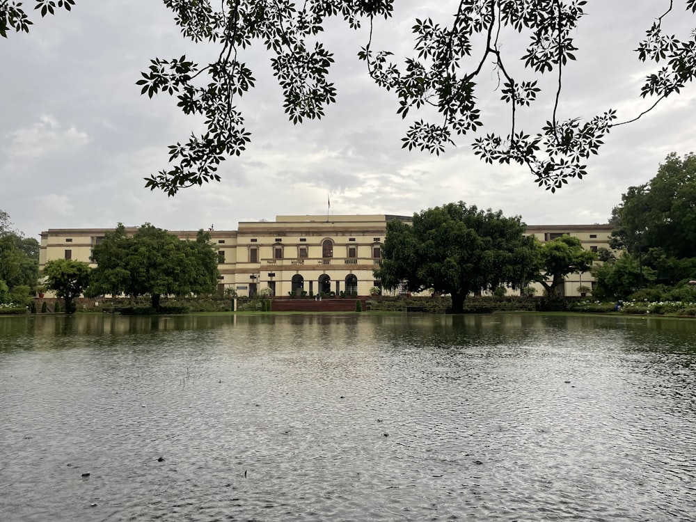 a large building sitting next to a body of water