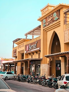 a row of motorcycles parked in front of a building