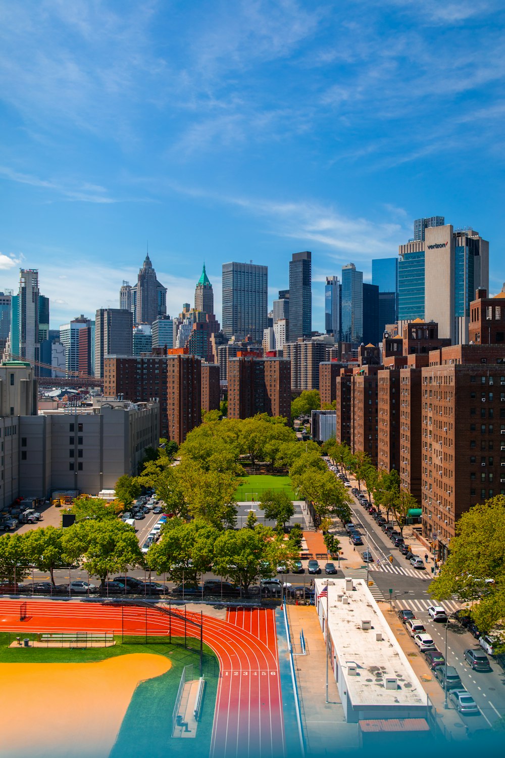 an aerial view of a city with tall buildings