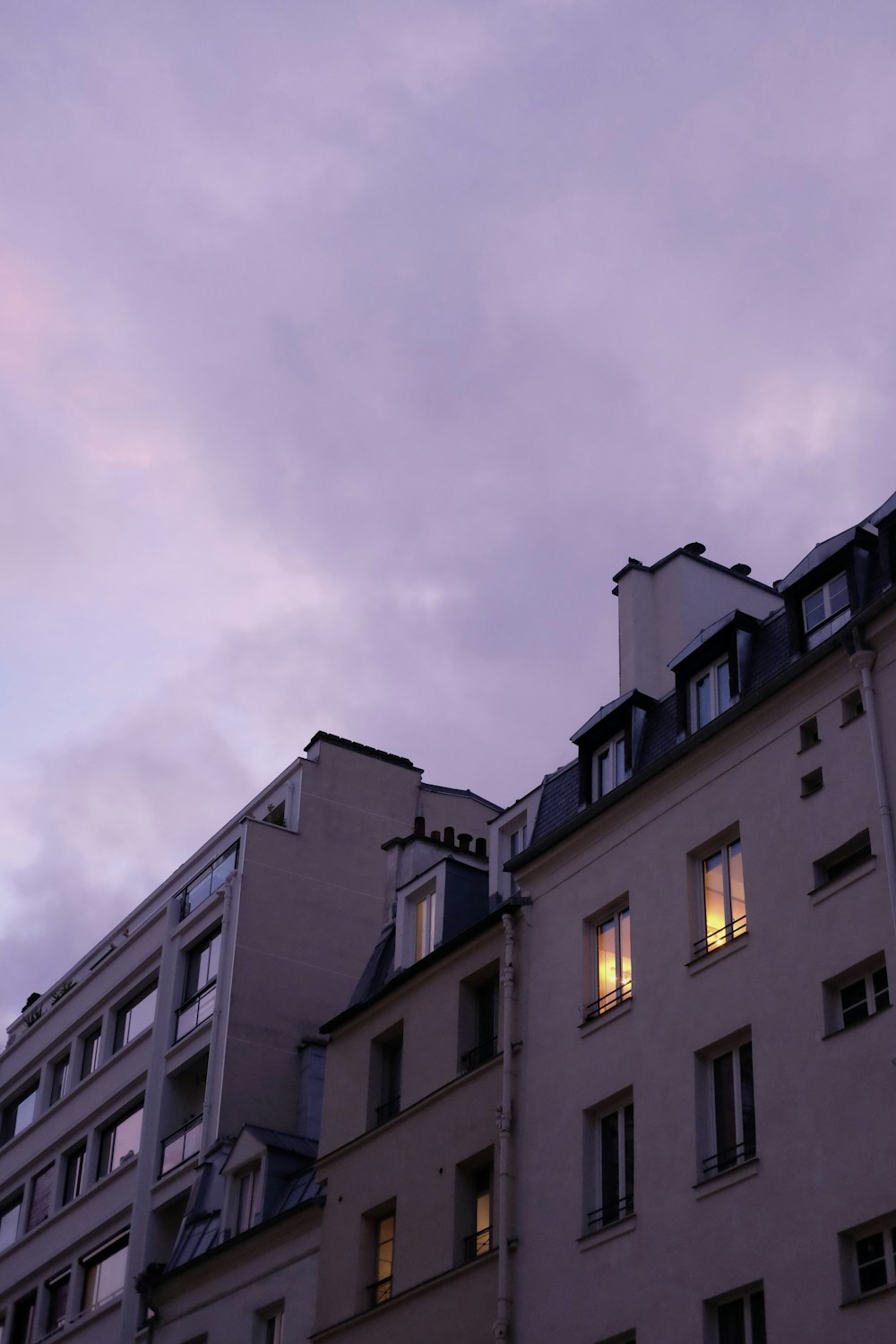 a very tall building with some windows and a sky in the background