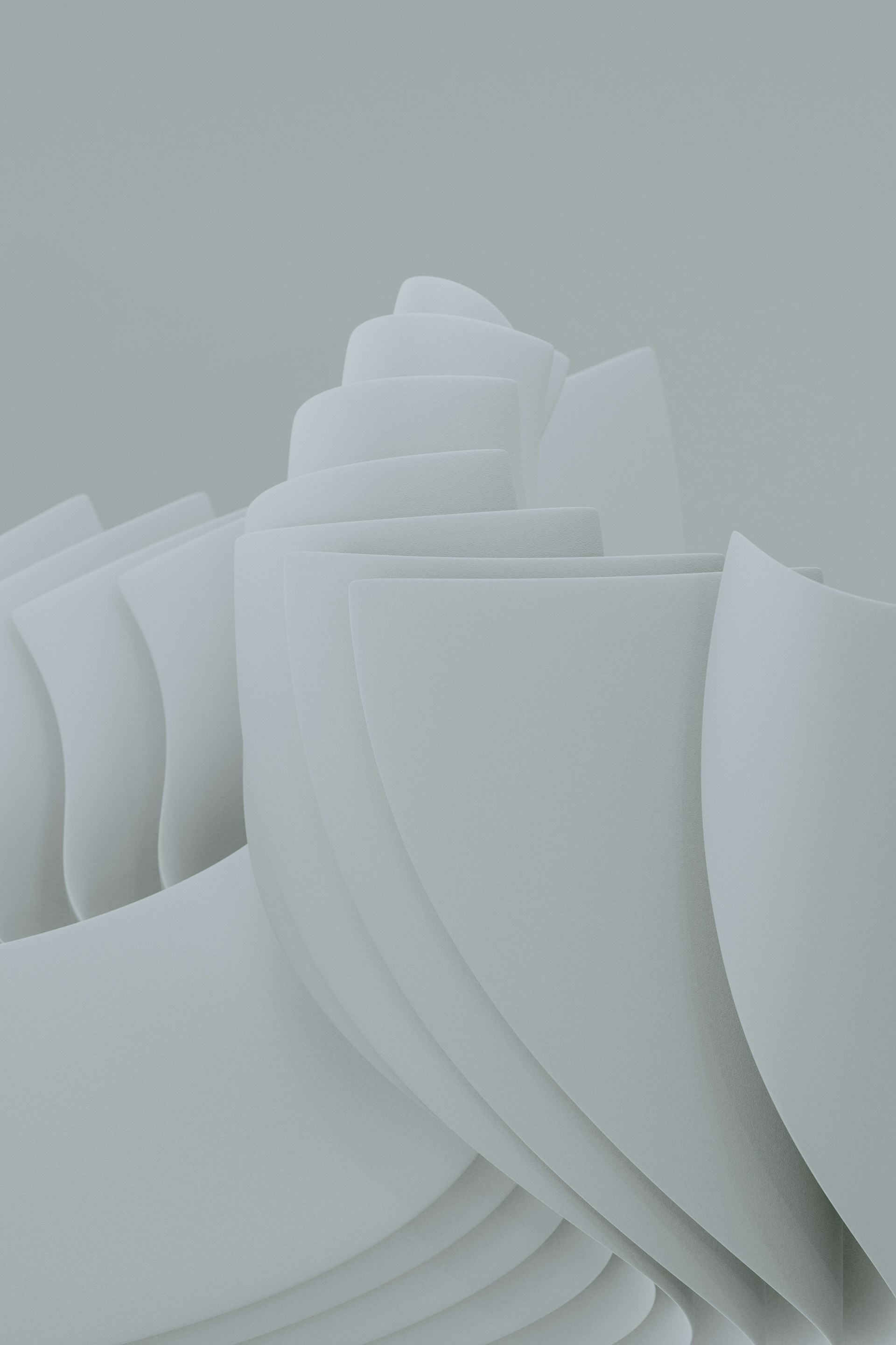a stack of white papers sitting on top of a table