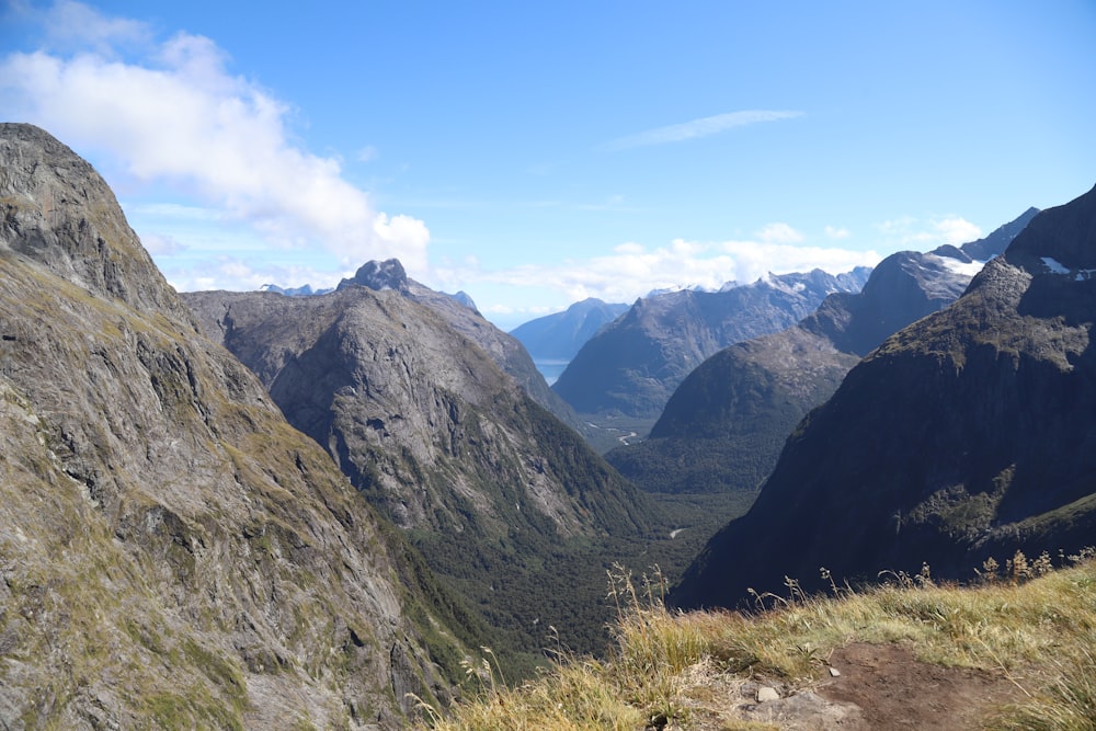 a view of a valley with mountains in the background