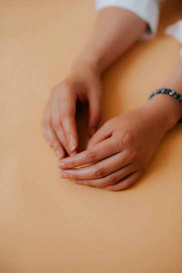 A serene shot of the bracelet resting on a raw selenite plate under gentle morning light.