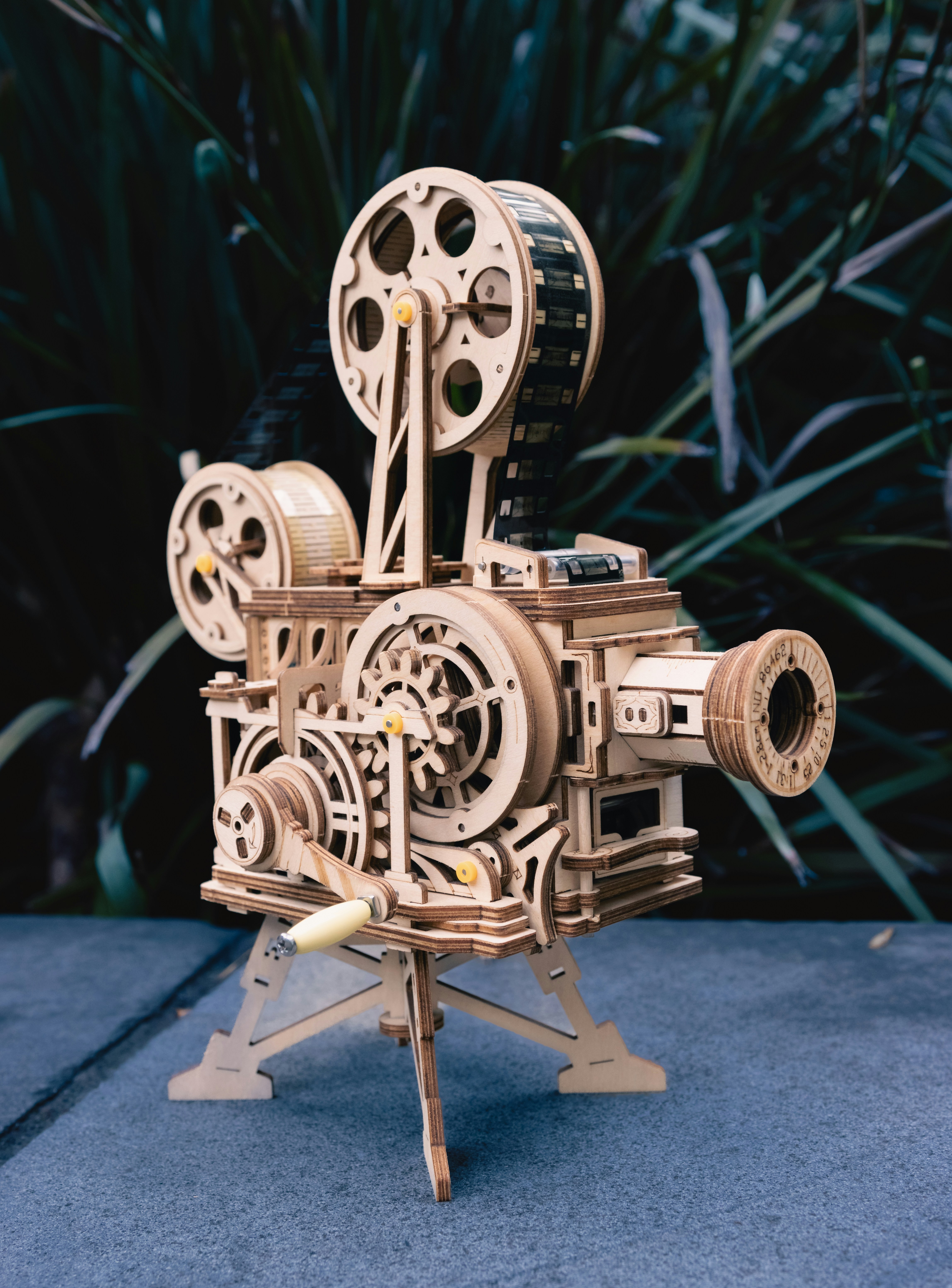 a wooden model of a movie projector