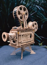 a wooden model of a movie projector