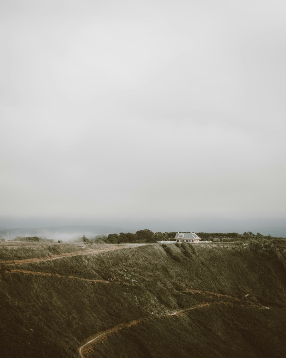 a hill with a house on top of it