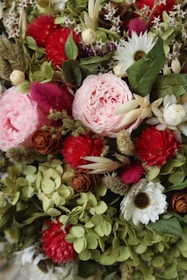 A vibrant display of seasonal flowers in a creative arrangement.