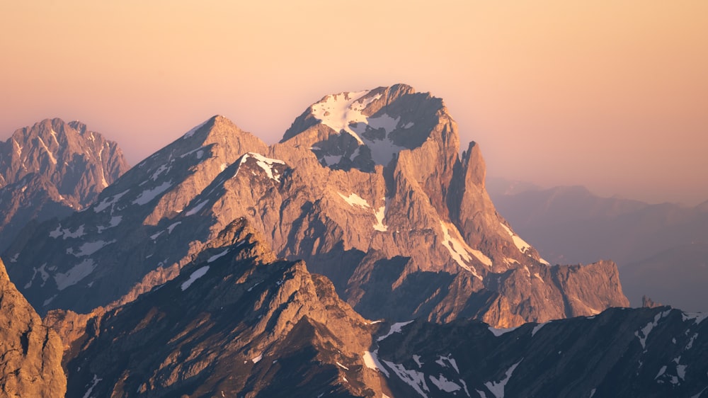 a view of a mountain range at sunset