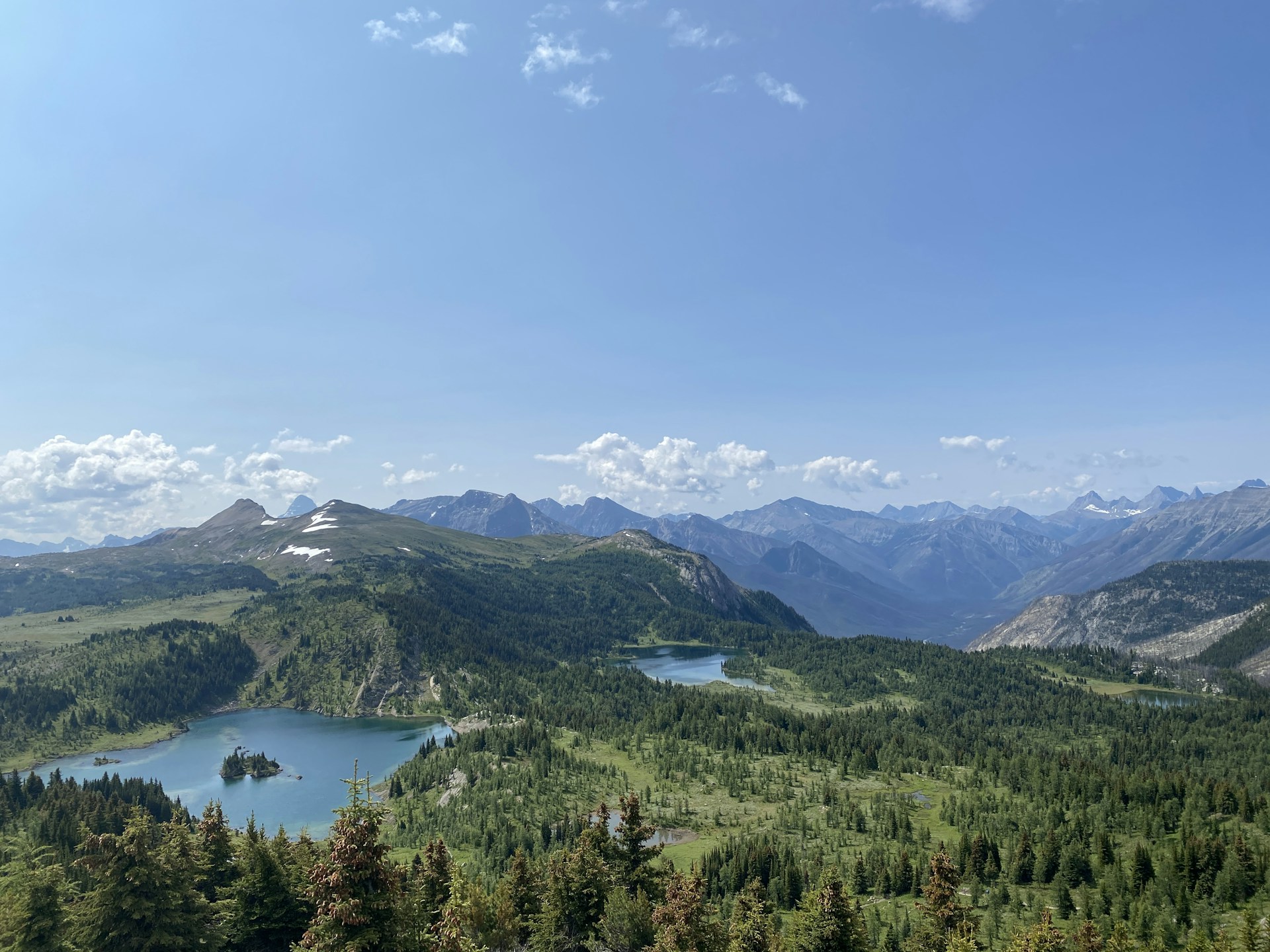 woman wearing yellow long-sleeved dress under white clouds and blue sky during daytime