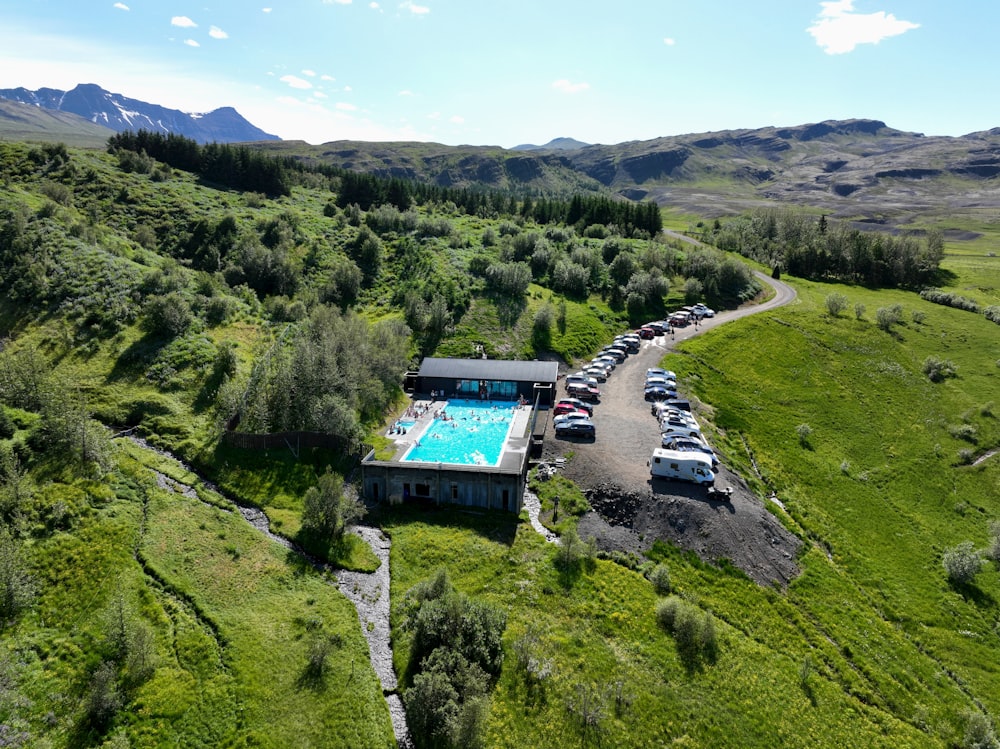 an aerial view of a car park with a swimming pool