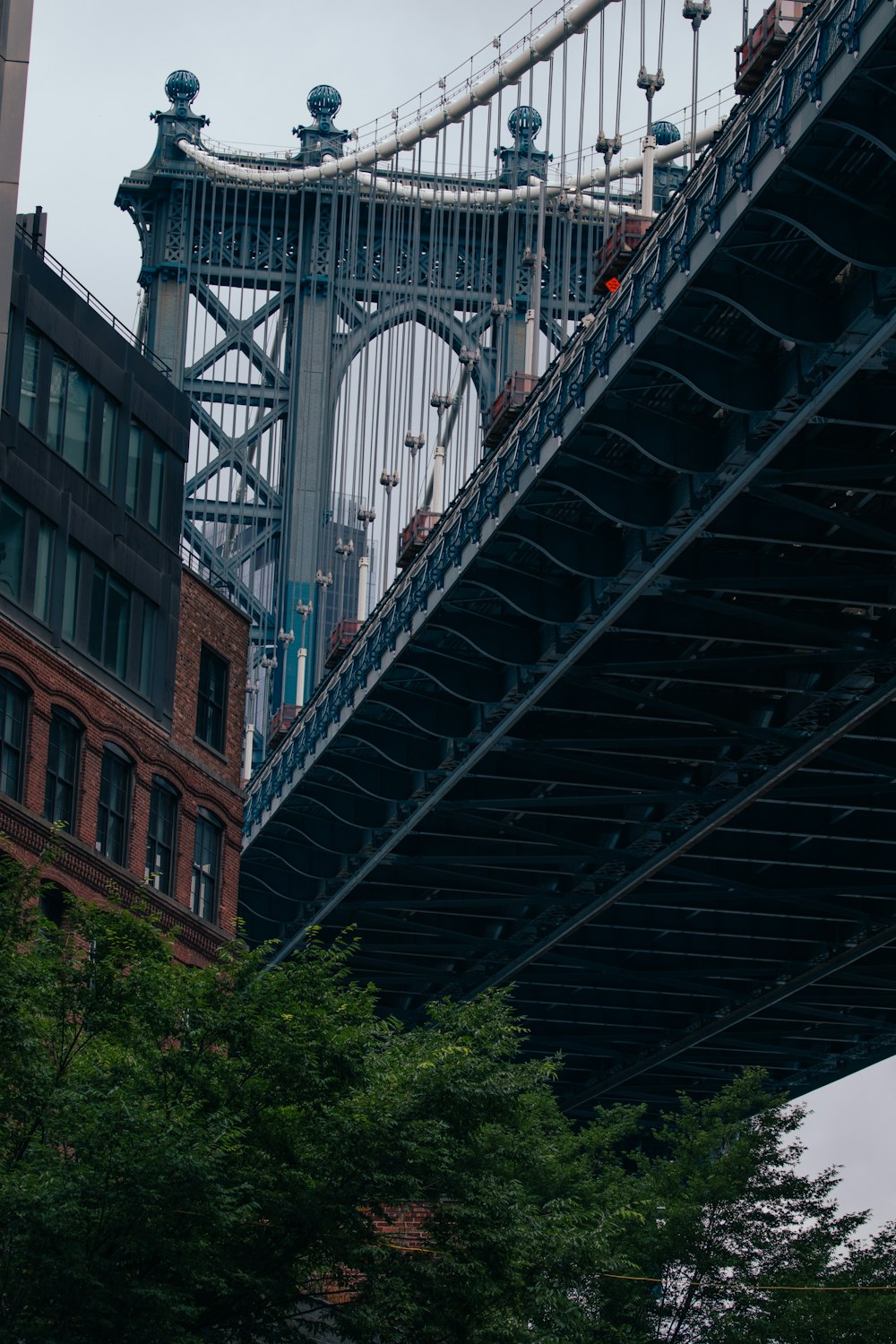 a large bridge spanning over a city with tall buildings