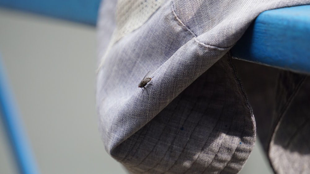 a close up of a hat on a bench