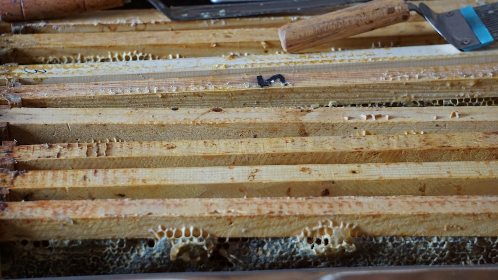 a close up of a box of wood with a hammer