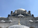 Exterior view of a historic Berlin mosque with intricate architectural details under a clear sky.