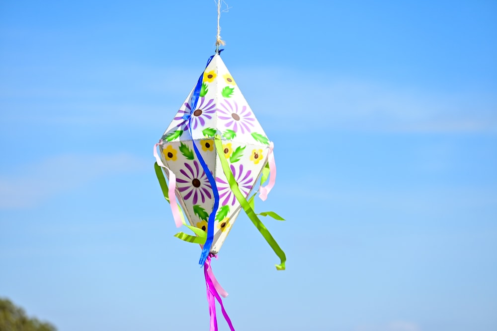 a colorful kite is flying in the sky