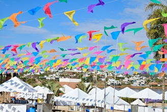 Vibrant circus tent with stars and colorful flags fluttering in the breeze.