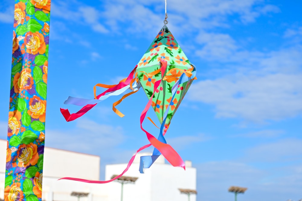 a kite that is hanging from a pole