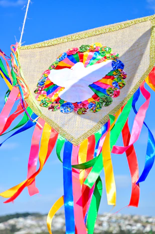 A peaceful blue and white cloud-patterned memorial banner.