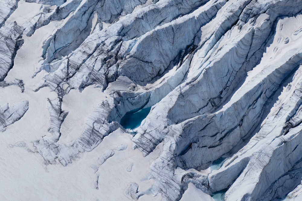 an aerial view of a snow covered mountain