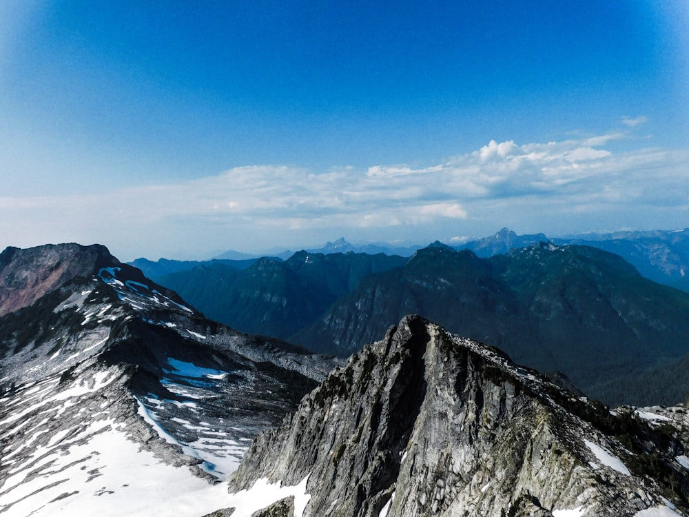 a view of a mountain range from the top of a mountain