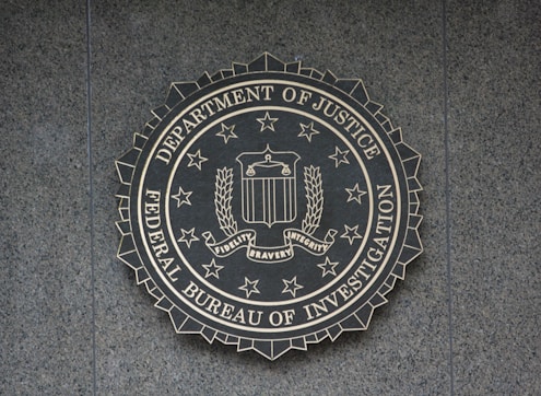 the seal of the department of justice on a wall