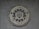 A circular seal of the Federal Bureau of Investigation is set against a textured surface. The seal includes the Department of Justice's name, an eagle, a shield, and the words Fidelity, Bravery, Integrity.