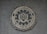 A circular seal of the Federal Bureau of Investigation is set against a textured surface. The seal includes the Department of Justice's name, an eagle, a shield, and the words Fidelity, Bravery, Integrity.