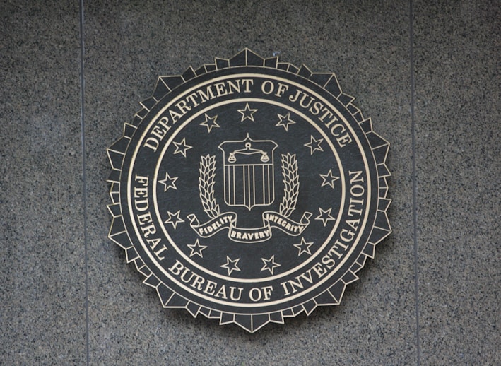 the seal of the department of justice on a wall