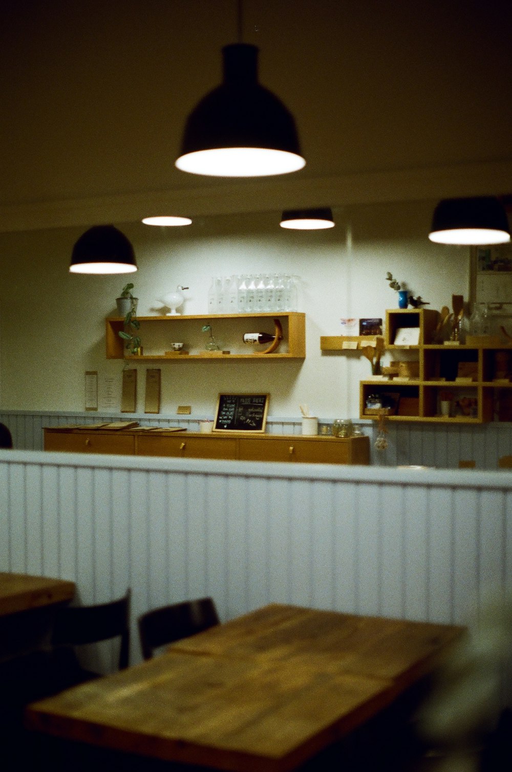 a restaurant with wooden tables and chairs