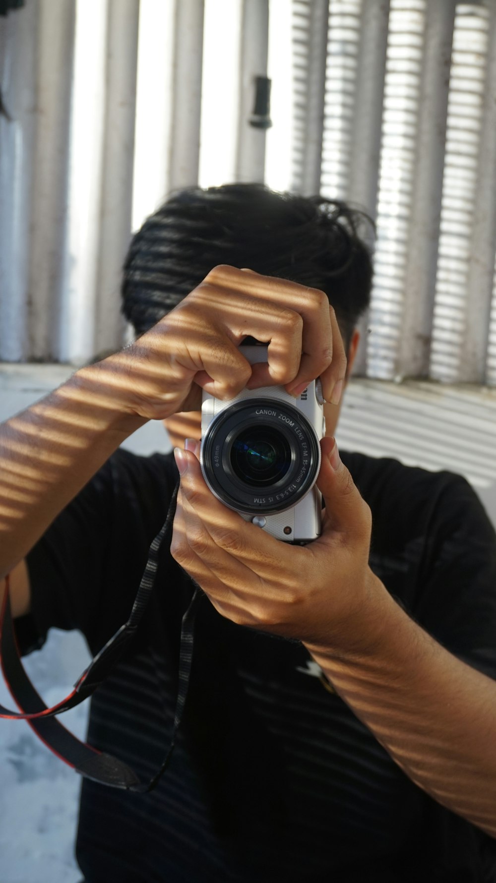 a man taking a picture of himself with a camera